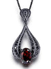BLACKENED GOLD TWIST PENDANT WITH GARNET AND BLACK SPINEL